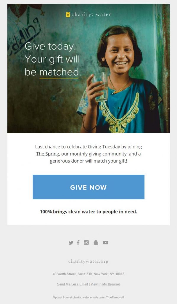 charity: water's Giving Tuesday email campaign featuring a smiling South Asian girl holding a glass of clean water